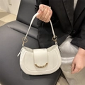 White minimalist saddle bag for women with golden metal moon accent and smooth leather finish - White
