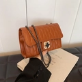 Brown quilted leather shoulder bag with a clover metal buckle and chain strap - Brown