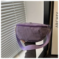 Detail of purple nylon crescent bag with silver zipper and black metal logo plate - Purple