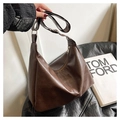 Detailed view of the dark brown oil wax leather texture and silver zipper on the tote bag - Coffee (No Pendant)