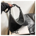 Detail of black Hobo tote bag with retro pleated texture and wide shoulder strap - Black (Without Charm)