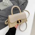 Chic beige textured crossbody bag with gold metallic buckle and elegant top handle - Khaki
