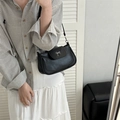 Chic black leather shoulder bag with vintage silver bow buckle detail and slim strap - Black