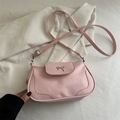 Pink minimalist saddle bag with a decorative silver metal bow and adjustable strap - Pink