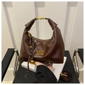 Detail of dark brown glossy tote bag with gold lettering and braided rope charm - Coffee with Pendant