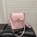 Minimalist light pink bucket crossbody bag with gold horseshoe buckle and PU leather strap - Pink