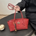Vibrant red faux leather tote bag with gold logo plate and bell charm accent - Red (With Pendant)