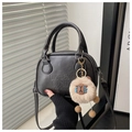 Detail of black faux leather bag with lucky OHIO embossing and plush sheep pendant - Black With Pendant