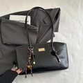 Classic black tote bag with gold metal plate and striped woven pendant on a blazer - Black (With Pendant)