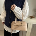 Minimalist apricot leather bowling bag with gold zippers and adjustable shoulder strap - Khaki