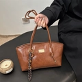 Vintage brown leather tote bag with metallic logo and woven tassel detail for women - Brown (With Charm)