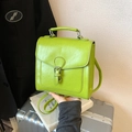 Chic neon green faux leather backpack and handbag for women shown in lifestyle setting - Green Without Pendant