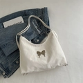 Minimalist white nylon shoulder bag with silver butterfly metal buckle and soft pleated texture - White