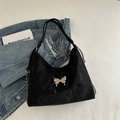 Black crinkled shoulder bag featuring a silver metal butterfly logo and chain detail - Black
