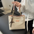 Beige woven tote bag with pink faux leather handles and gold chain details - Pink With Pendant