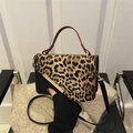 Leopard print crossbody bag with black body, red edges and gold metal handle details - Brown