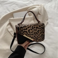 Fashionable leopard print contrast crossbody bag with gold hardware and top handle - Black