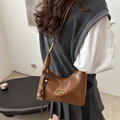 Brown vintage faux leather half-moon crossbody bag with gold metal logo and charm - With Pendant / Brown