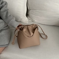 Retro light brown drawstring bucket bag made of matte faux leather with shoulder strap - White