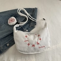 White corduroy crossbody bag with red embroidery detail and matching small round coin purse - White