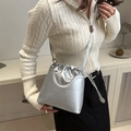 Metallic silver drawstring bucket bag with adjustable strap and sleek high-shine finish - Silver