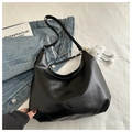 Detail of black leather hobo bag featuring logo embossing and white plush cloud pendant - No Pendant / Black