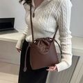 Chocolate brown leather bucket bag with drawstring closure and adjustable strap - Brown