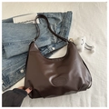 Detailed shot of soft dark brown leather hobo bag with vintage texture and plush charm - No Pendant / Brown