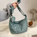 Chic corduroy hobo bag in sage blue with matching round coin purse and white embroidery - Light Green