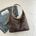 Large leopard print hobo tote bag with brown leather strap and urban vintage style - Brown