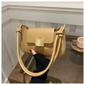 Minimalist tan leather shoulder bag with oversized gold square buckle and knot strap detail - Khaki