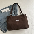 Brown corduroy shoulder tote bag with Fashion Instinct label on a white flat lay - Brown