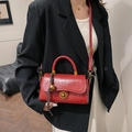 Red retro oil wax leather handbag with gold circular metal clasp and woven rope accent - Red (With Pendant)