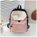 Close-up of pink and beige patchwork backpack with a minimalist round mountain logo - Pink Small