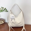 Creamy white nylon tote bag with logo embossing and fluffy cloud charm accessory - Tote Bag With Cloud Charm / Off White