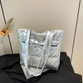 Silver quilted tote bag with metallic finish and magnetic snap for trendy commuters - Silver