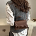 Dark brown leather crossbody bag with white contrast stitching and gold metal hardware - Brown
