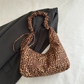 Leopard print hobo shoulder bag with pleated handle on white textured fabric background - Brown