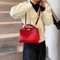 Red crocodile embossed leather handbag with gold metal clasp and top handle for women - Red