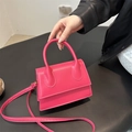 Mini hot pink handbag with top handle and crossbody strap in premium textured finish - Rose Pink