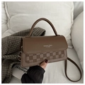 Detail of brown PU leather handbag featuring checkered pattern and top handle design - Brown