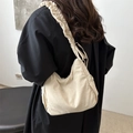 Chic beige nylon cloud bag featuring pleated wide shoulder strap and drawstring details - White