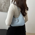 Light blue crescent shoulder bag with geometric circles and a silver bow clasp - Blue