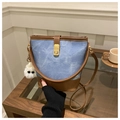 Detail of blue denim and brown leather bucket bag with gold clasp and plush charm - With White Glasses Charm / Blue