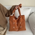 Vibrant orange corduroy tote bag featuring white embroidered letters and handle details - Brown