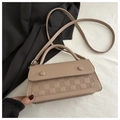 Detail of light brown crossbody bag featuring checkered embossed texture and clasp - Khaki