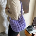 Chic purple quilted shoulder bag featuring bubble stitch texture and padded strap - Purple