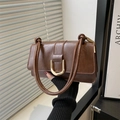 Retro brown leather shoulder bag with gold buckle and elegant knotted handle style - Brown