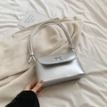 Chic silver shoulder bag with metallic bow detail and knotted strap in a minimalist style - Silver