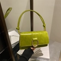 Glossy olive green baguette bag with a large gold buckle and slim shoulder strap - Green